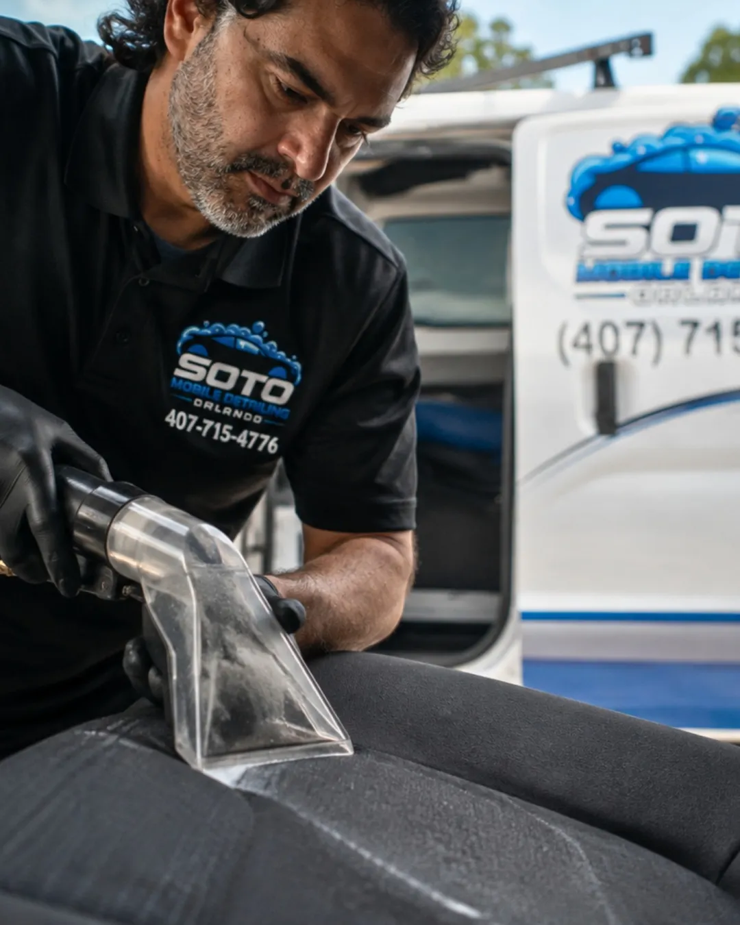 Interior detailing in Orlando, FL · problem guide section Interior detailing in Orlando, FL · owner cleaning a cloth seat with the upholstery tool