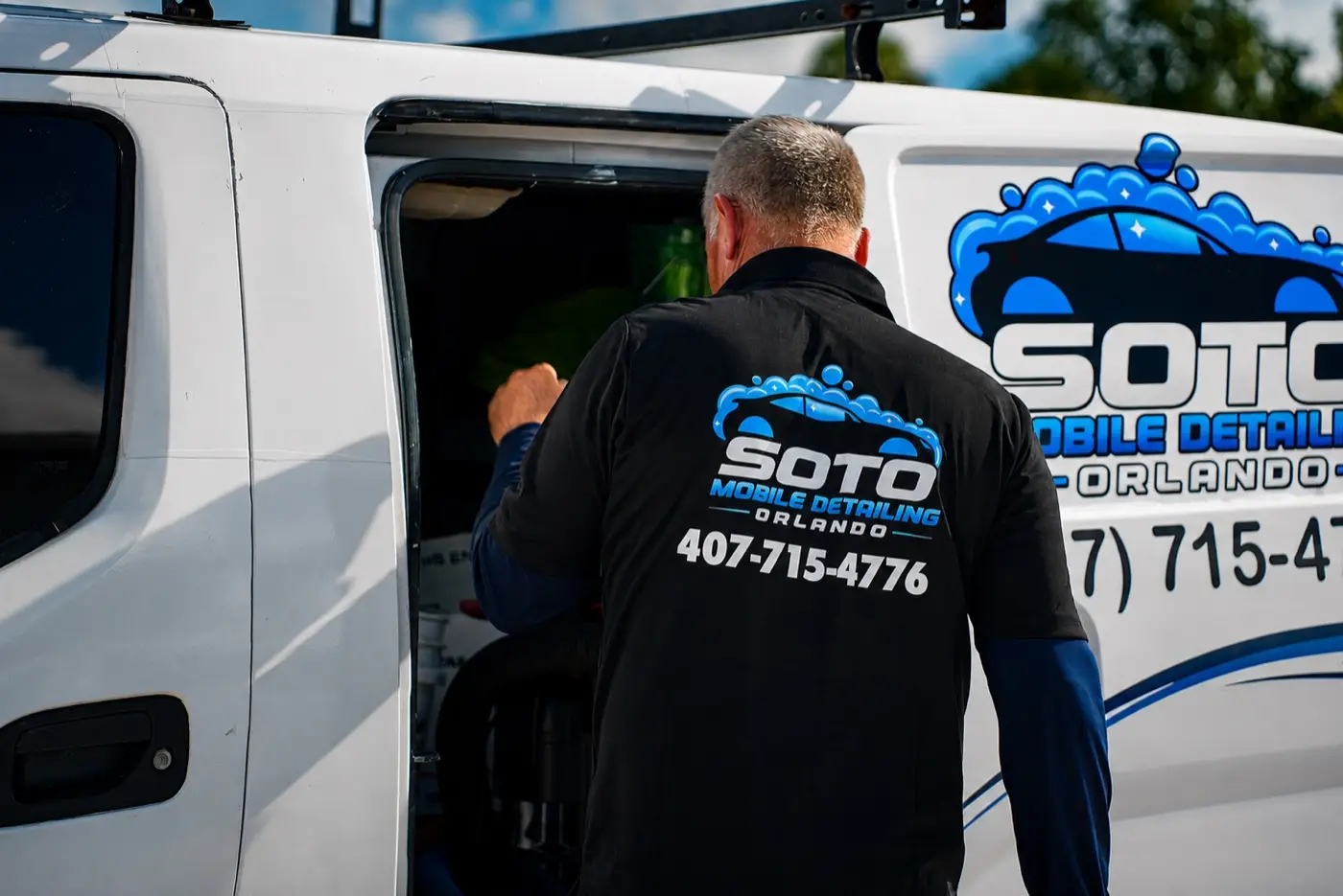 Soto detailer loading the branded van before a mobile detailing appointment in Orlando